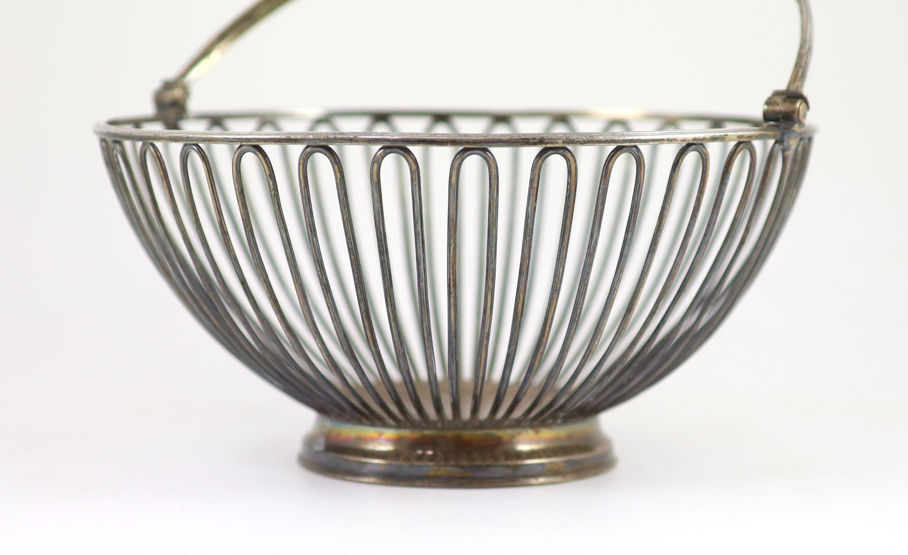 A George III silver wire work circular fruit basket, by Wakelin & Garrard